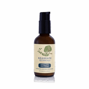 Facial cleanser bottle on black background.
